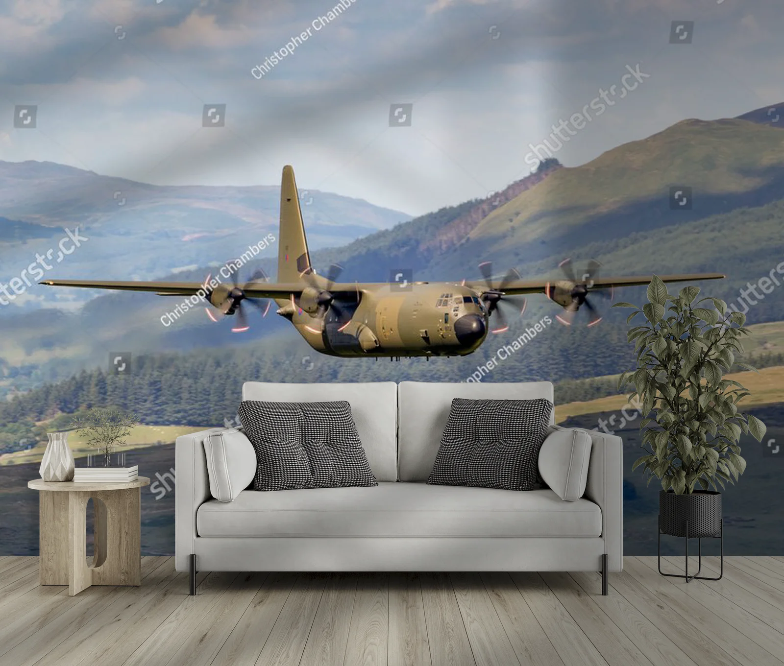 Zielony Lockheed C-130 Hercules nad malowniczym krajobrazem