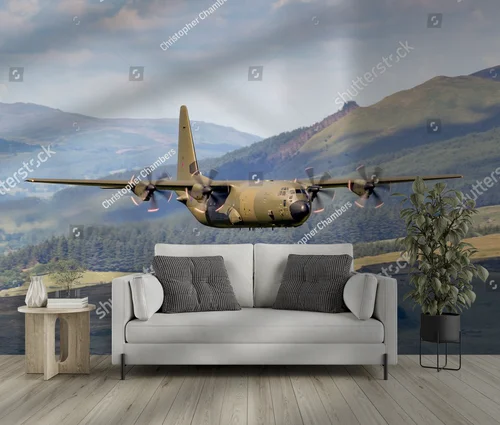 Zielony Lockheed C-130 Hercules nad malowniczym krajobrazem